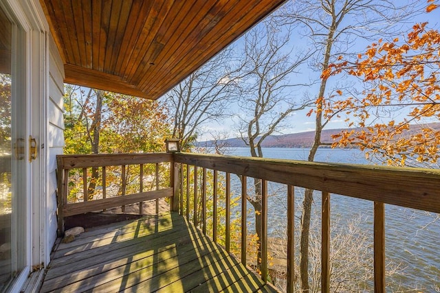 wooden deck with a water view