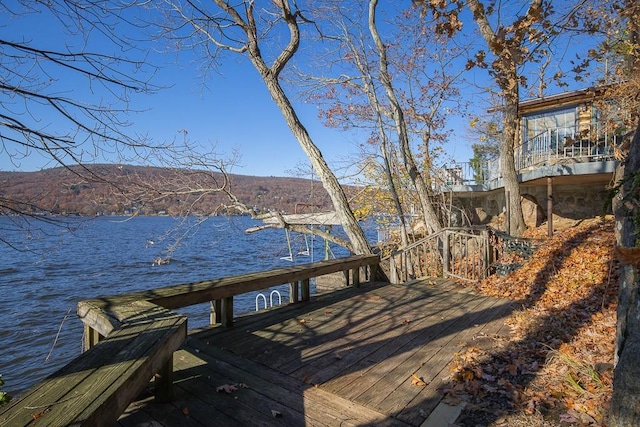 dock area featuring a water and mountain view