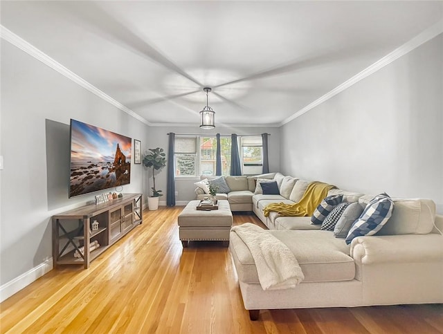 living room featuring hardwood / wood-style floors and ornamental molding