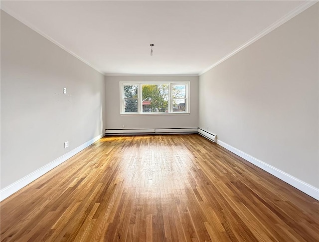 empty room with light hardwood / wood-style flooring, a baseboard radiator, and ornamental molding