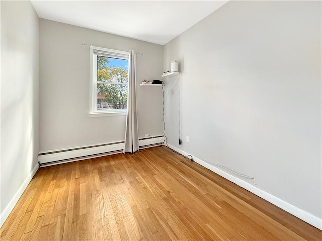 unfurnished room with light hardwood / wood-style flooring