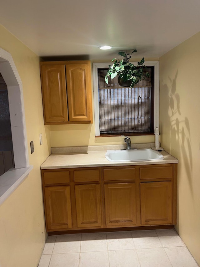 bathroom with tile patterned flooring and sink