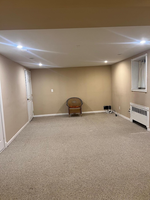 basement with radiator and carpet floors