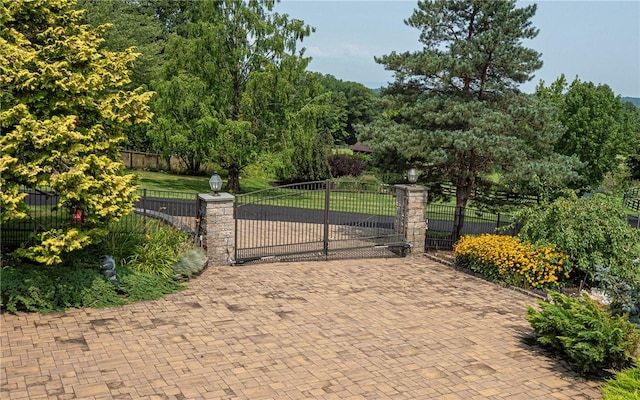 view of gate featuring a yard