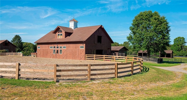 view of property exterior featuring an outdoor structure