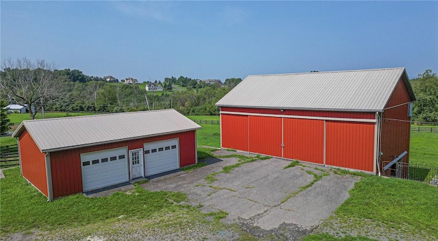 garage featuring a yard