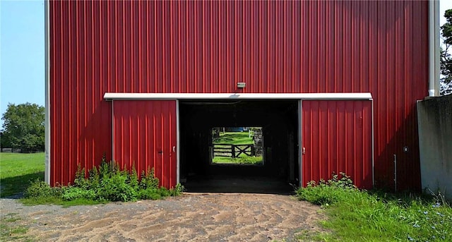 view of gate featuring an outdoor structure