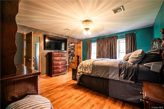 bedroom featuring ceiling fan and light hardwood / wood-style floors