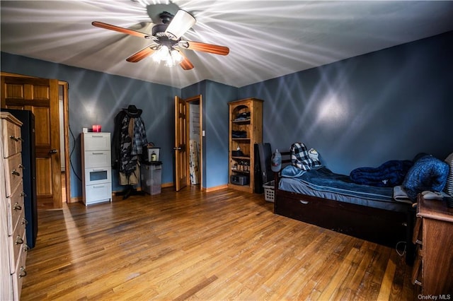 unfurnished bedroom with hardwood / wood-style floors and ceiling fan