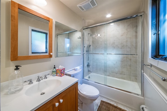 full bathroom with tile patterned flooring, vanity, toilet, and enclosed tub / shower combo