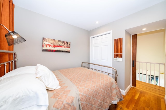 bedroom featuring a closet and light hardwood / wood-style flooring