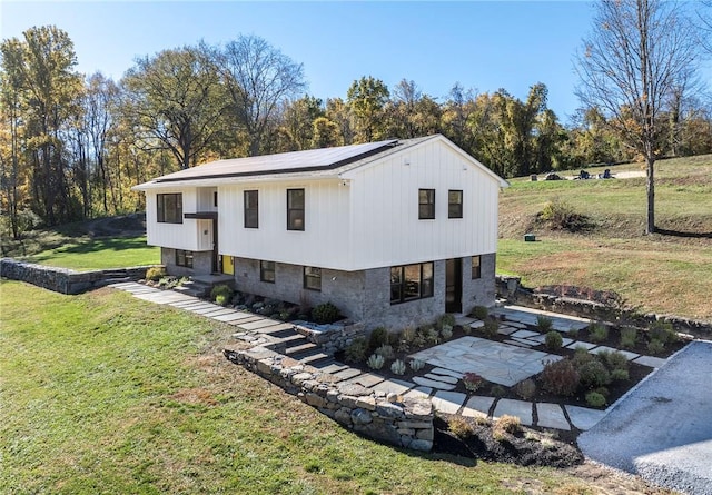 exterior space featuring solar panels, a yard, and a patio area