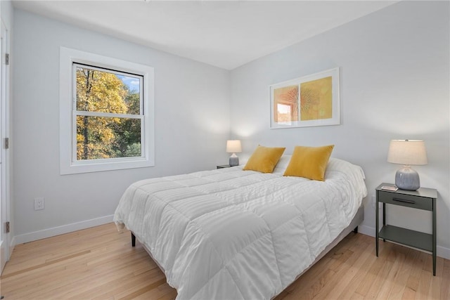 bedroom with light hardwood / wood-style flooring