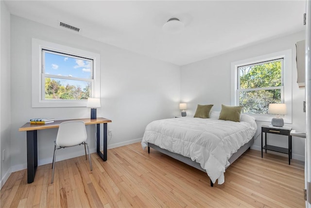 bedroom with light wood-type flooring