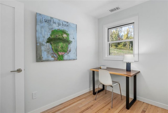 home office with light wood-type flooring