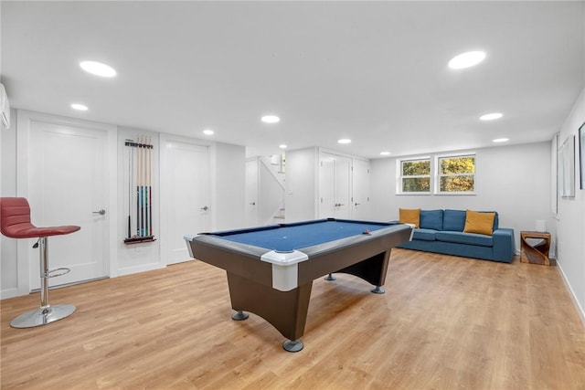 game room with light hardwood / wood-style floors and pool table