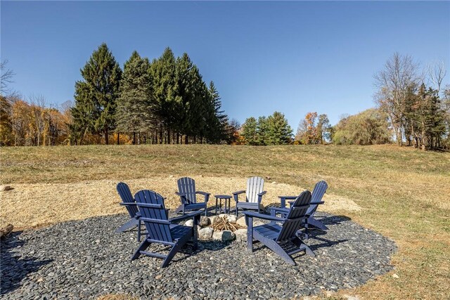 view of yard with a fire pit