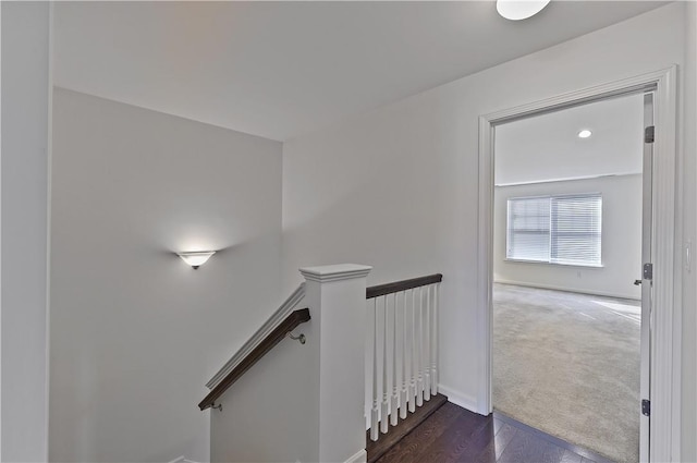 staircase with hardwood / wood-style floors