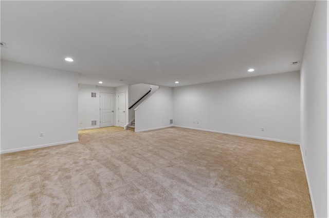 basement with light colored carpet