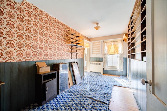 interior space with hardwood / wood-style floors and radiator