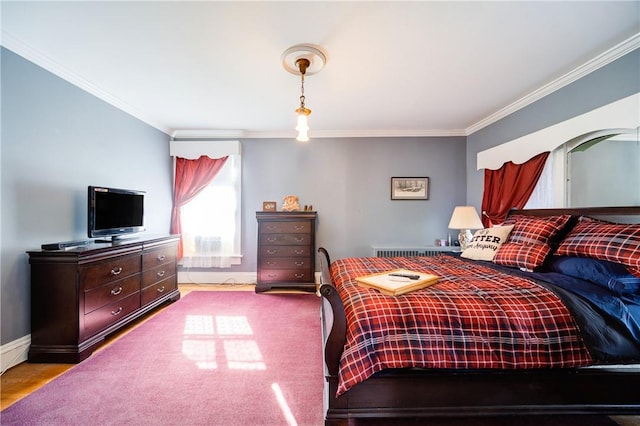 bedroom with crown molding and light wood-type flooring