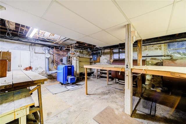 basement with a workshop area and electric panel