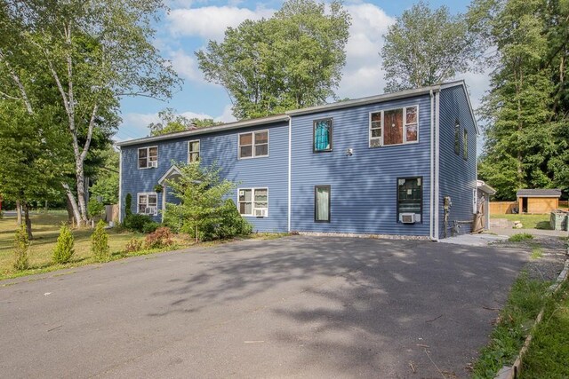 4 Newport Dr, Nanuet, NY 10954 - view of front of house featuring asphalt driveway and cooling unit