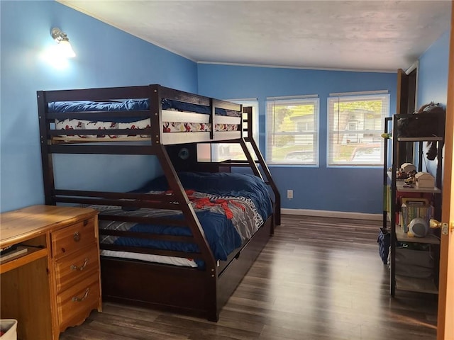 bedroom featuring dark hardwood / wood-style flooring and vaulted ceiling