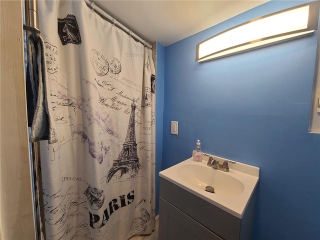 bathroom featuring vanity and walk in shower