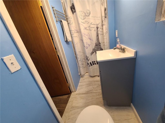 bathroom with vanity and toilet