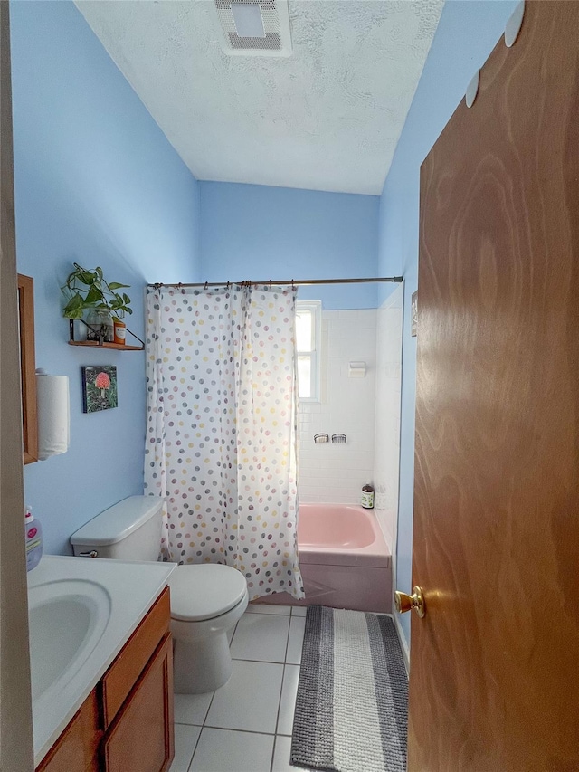 full bathroom featuring toilet, shower / tub combo, a textured ceiling, vanity, and tile patterned flooring