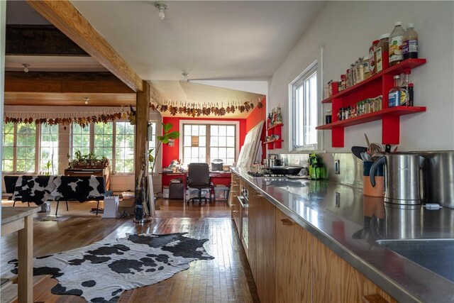 24921 State Highway 97, Hancock, NY 13783 - kitchen featuring beamed ceiling, stainless steel counters, and dark hardwood / wood-style flooring