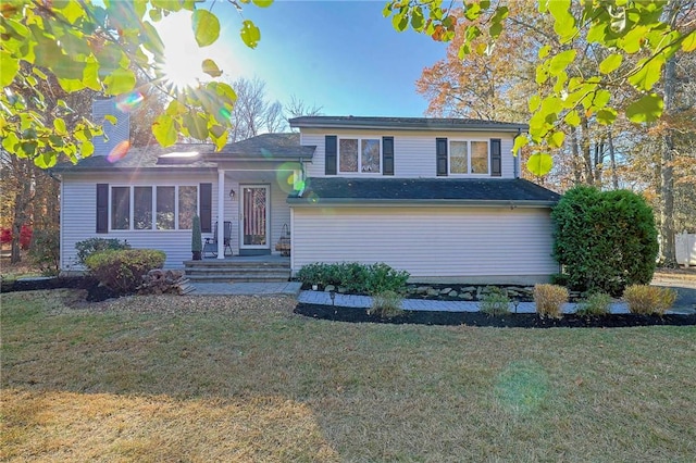 split level home featuring a front yard