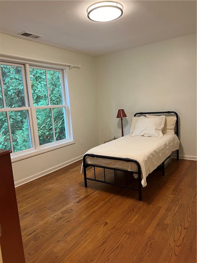 unfurnished bedroom featuring wooden walls