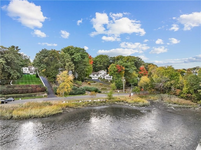 surrounding community featuring a water view