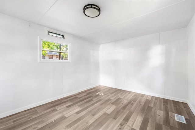 spare room featuring hardwood / wood-style floors