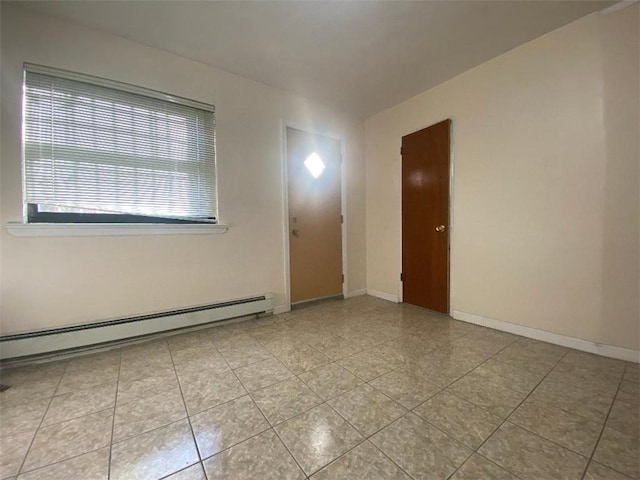 spare room featuring baseboard heating