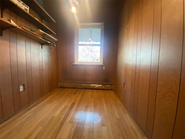 interior space with light wood-type flooring and baseboard heating