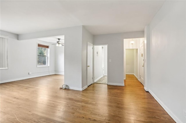 unfurnished room featuring wood-type flooring and ceiling fan