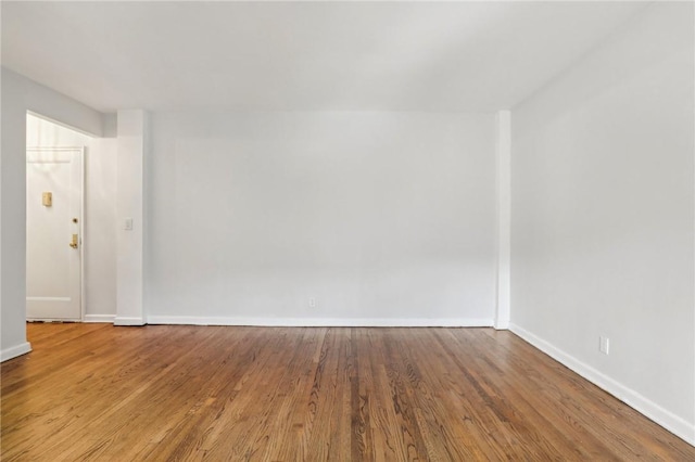 unfurnished room featuring wood-type flooring