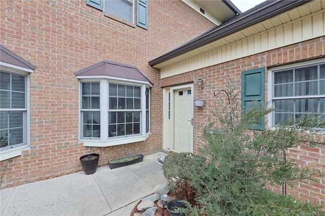 property entrance with a patio area