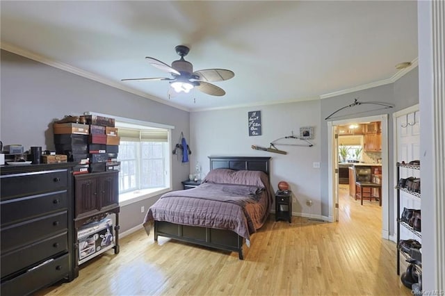 bedroom with ceiling fan, light wood-type flooring, ornamental molding, and multiple windows