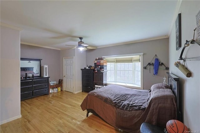 bedroom with ceiling fan, light hardwood / wood-style floors, and ornamental molding