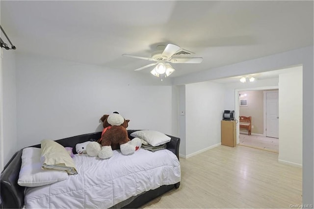 bedroom featuring light wood-type flooring and ceiling fan