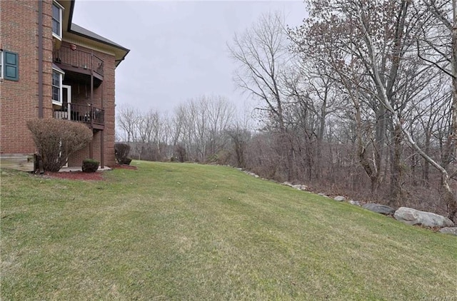 view of yard featuring a balcony