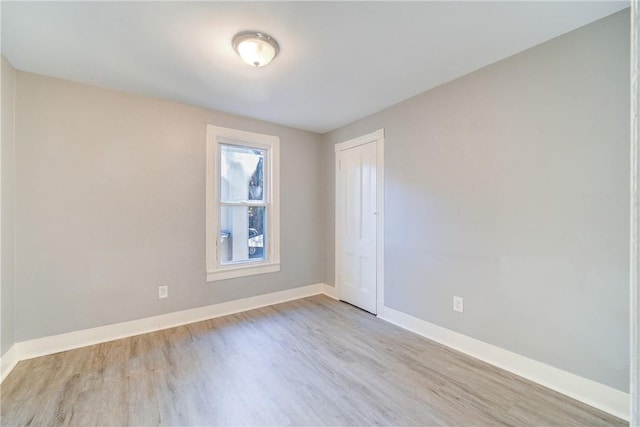 unfurnished room with light hardwood / wood-style floors