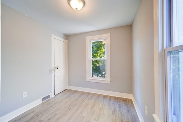 spare room with light hardwood / wood-style flooring