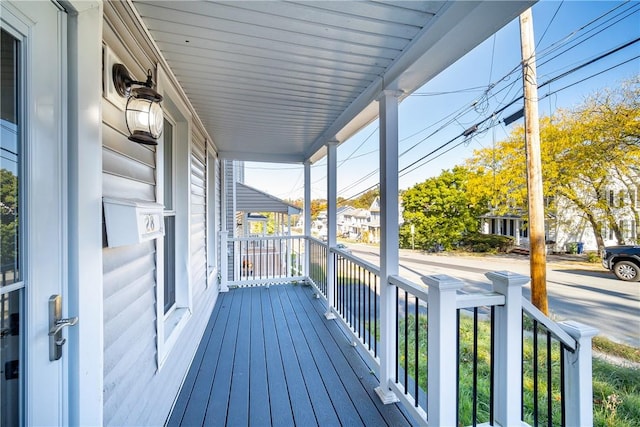 wooden terrace featuring a porch