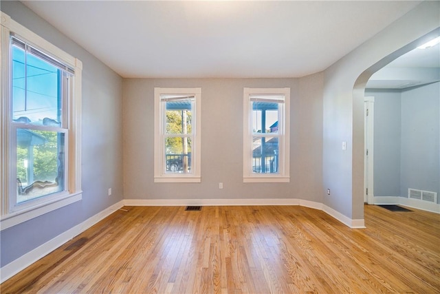 unfurnished room with light hardwood / wood-style flooring