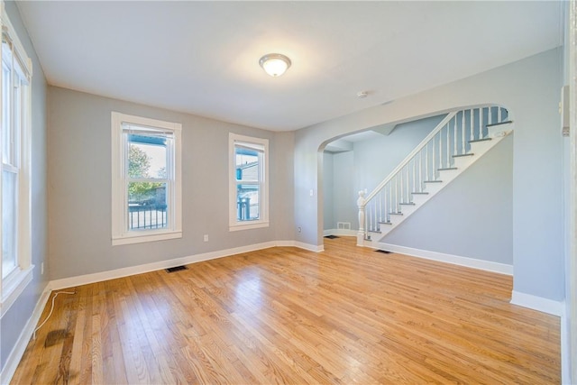 unfurnished room with light wood-type flooring